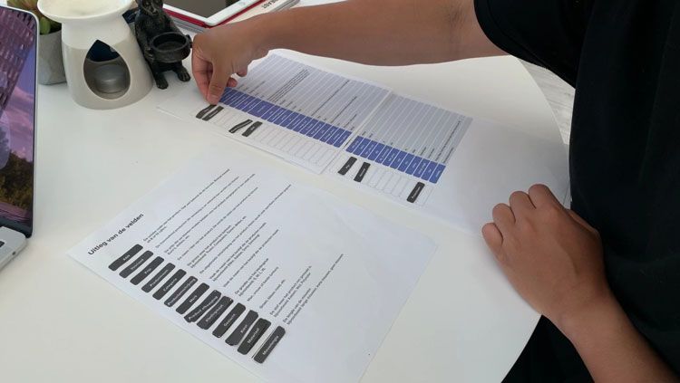 A test candidate trying out the paper prototype